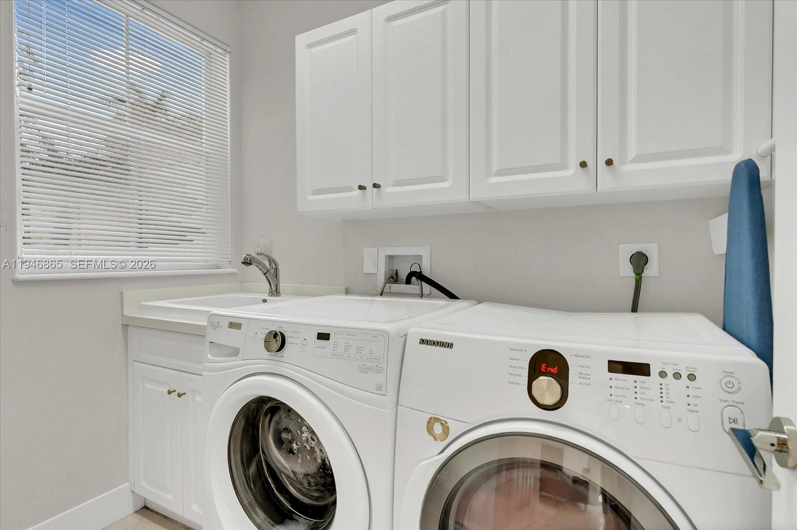 1469 Shoreline Way Hollywood, FL 33019 - Photo 30 of 46 a utility room with dryer and washer