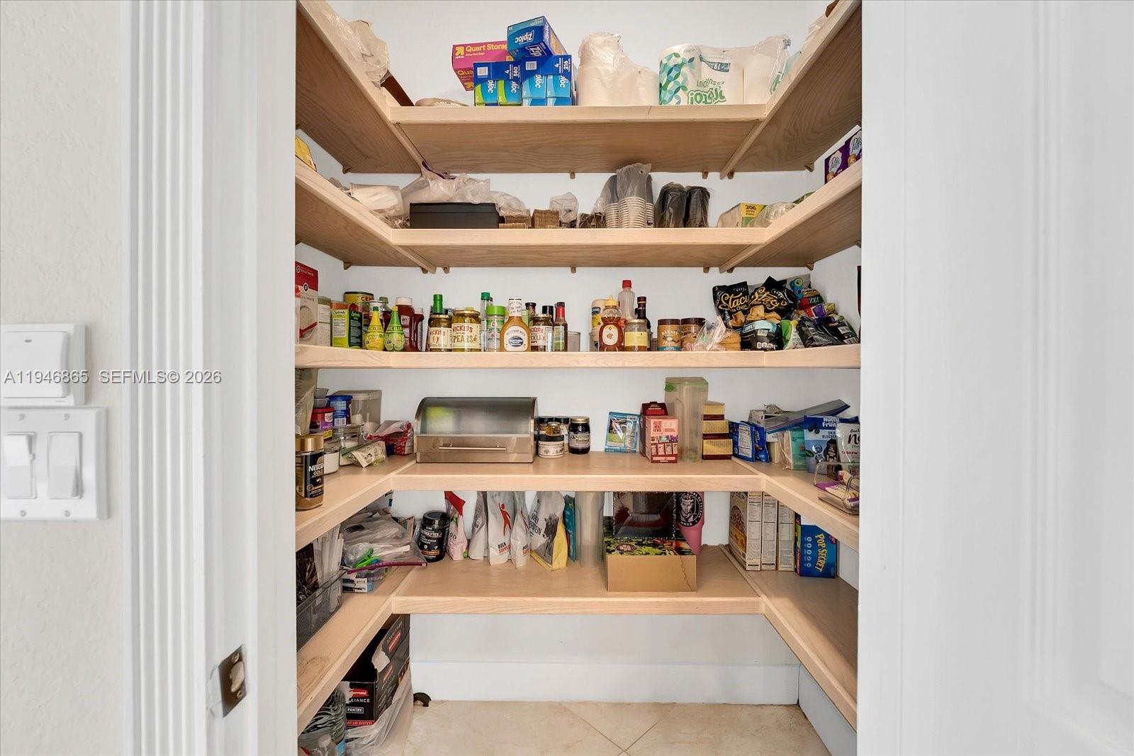 1469 Shoreline Way Hollywood, FL 33019 - Photo 31 of 46 a room with lots of different colored cloths