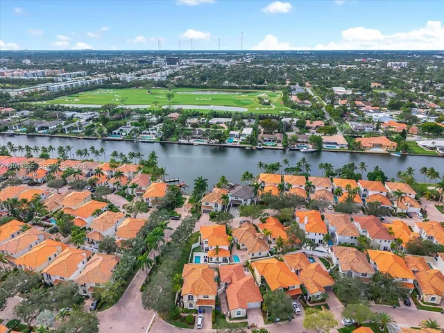 an aerial view of residential houses with outdoor space