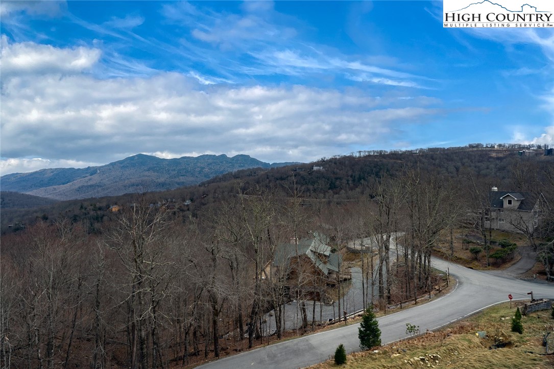 240 Ridgeline Drive, Unit D Sugar Mountain, NC 28604 - Photo 3 of 30 a view of a lake with a mountain in the background