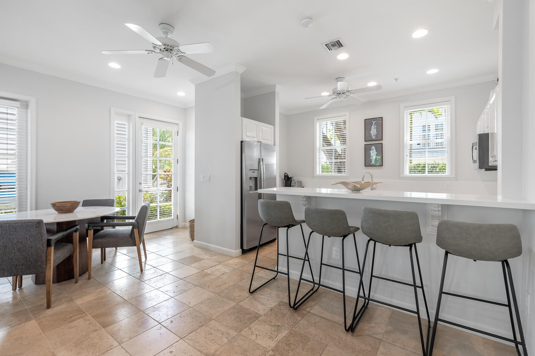 63 Sunset Key Drive Key West, FL 33040 - Photo 15 of 47 a view of a dining room with furniture and chandelier