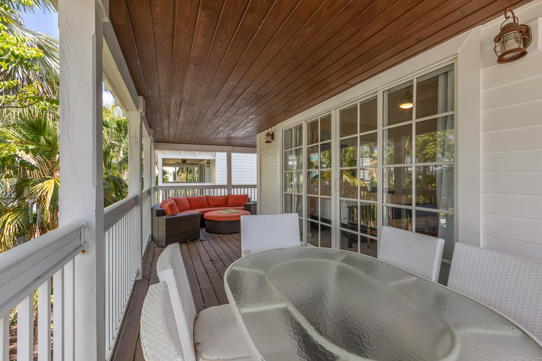 63 Sunset Key Drive Key West, FL 33040 - Photo 25 of 47 a balcony with furniture and a potted plant