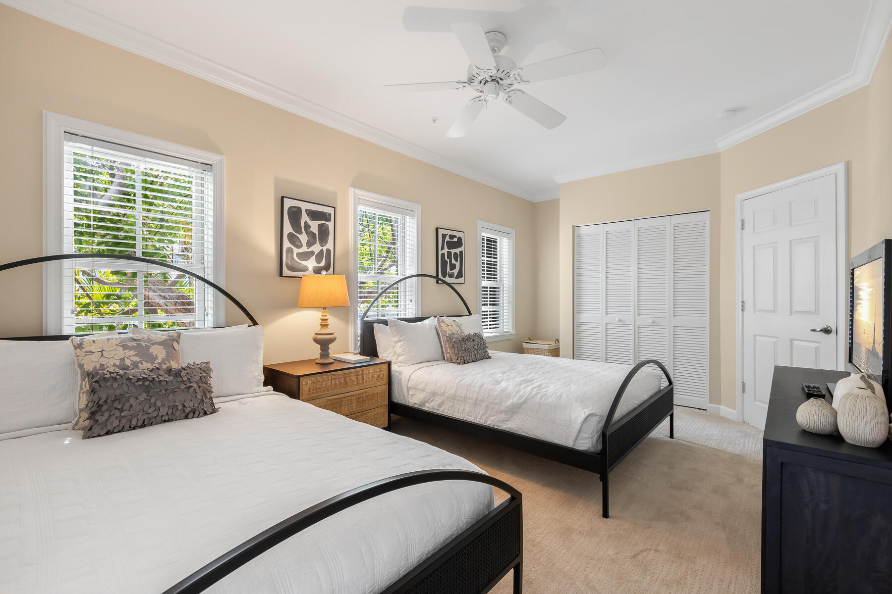 63 Sunset Key Drive Key West, FL 33040 - Photo 29 of 47 a bedroom with two beds and painting on the wall