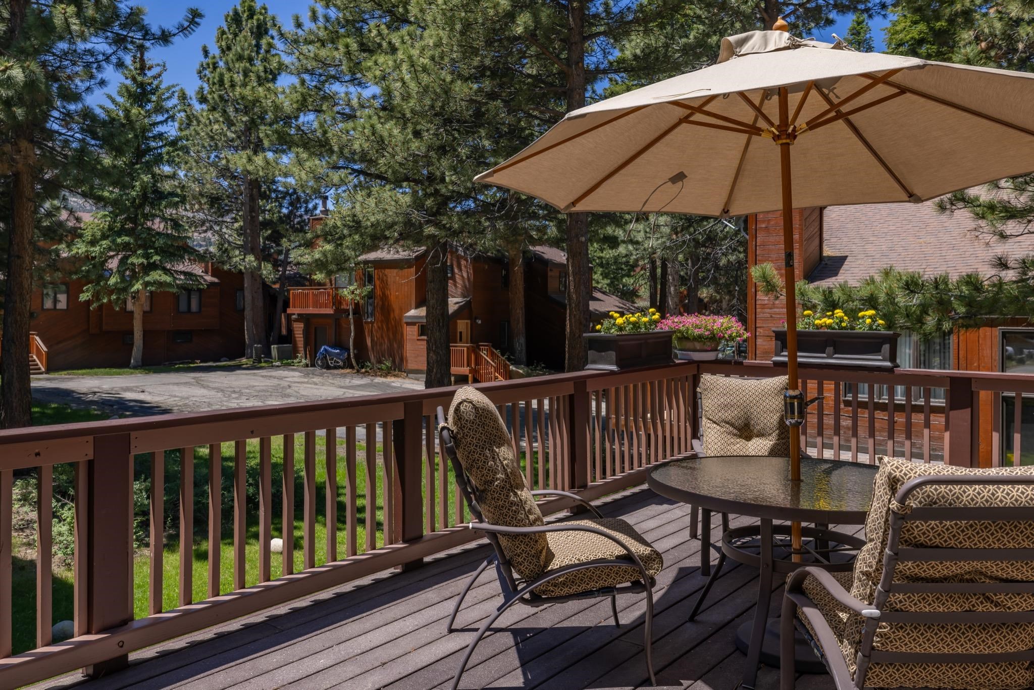 378 Ridge Way Mammoth Lakes, CA 93546 - Photo 38 of 43 Spacious exterior wood deck with a matching wood railing and built-in flower boxes