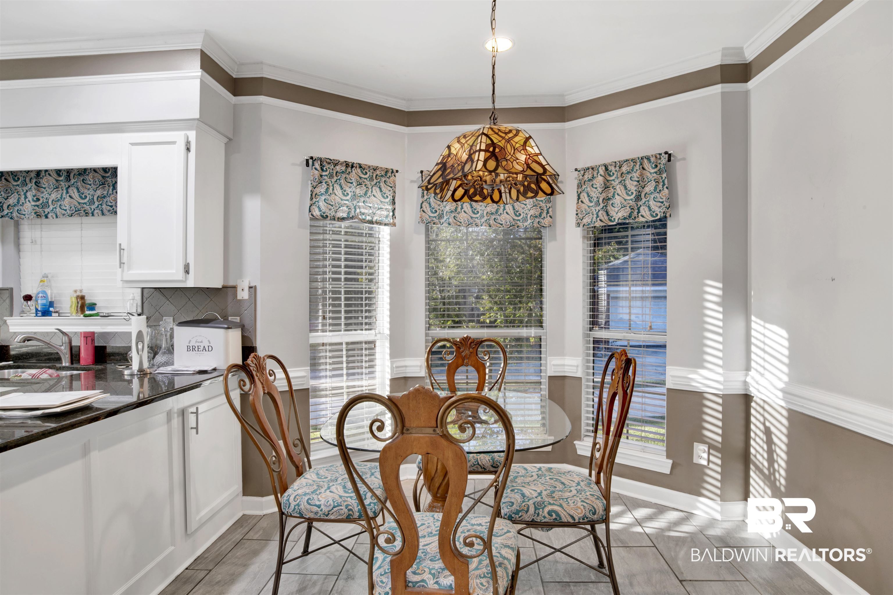 445 Wedgefield Drive South Mobile, AL 36608 - Photo 11 of 36 Dining space with a wealth of natural light, sink, and ornamental molding