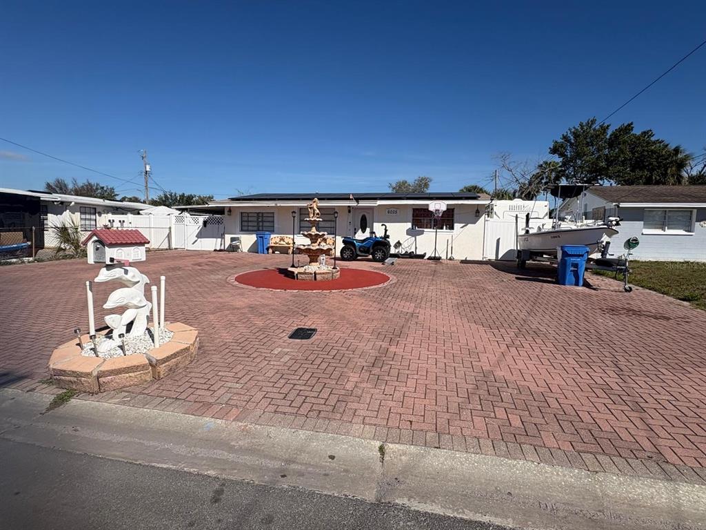 6005 West Clifton Street Tampa, FL 33634 - Photo 2 of 32 an outdoor space with patio and a garden