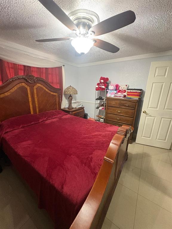 6005 West Clifton Street Tampa, FL 33634 - Photo 9 of 32 a bedroom with a bed and closet