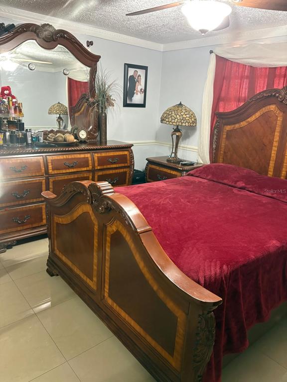 6005 West Clifton Street Tampa, FL 33634 - Photo 10 of 32 a bedroom with a bed and window