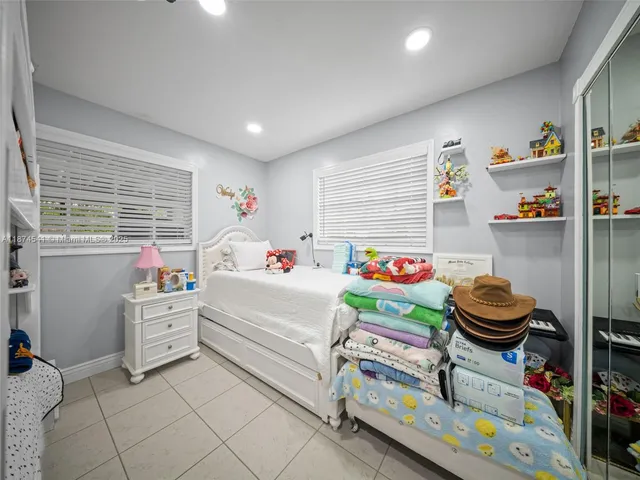 a view of a patio with table and chairs plants with wooden fence and roof