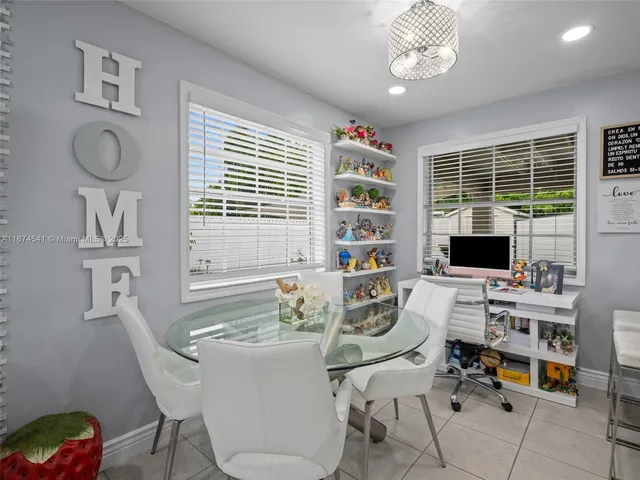 a dining room with furniture and window