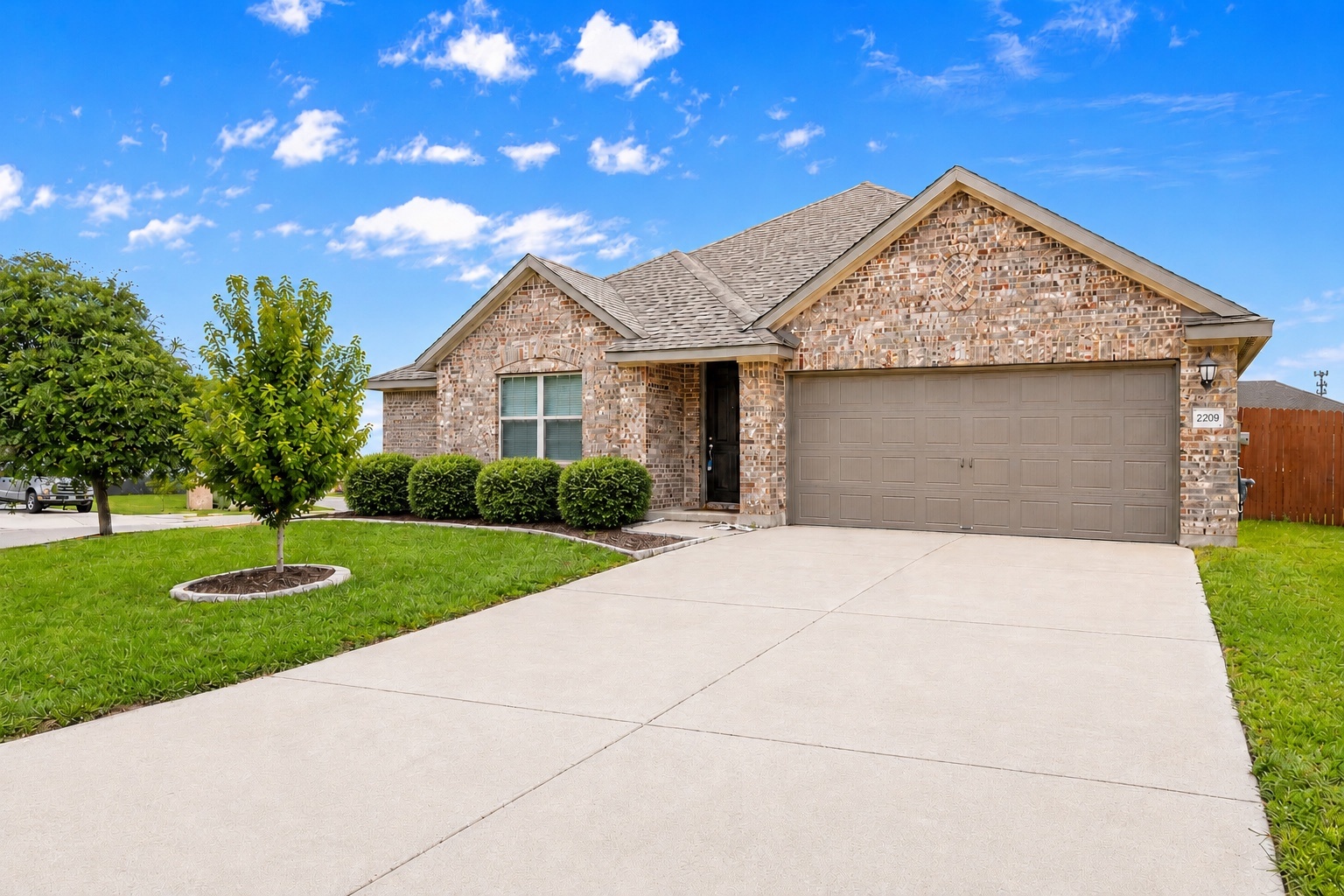 2209 Hat Bender Loop Round Rock, TX 78664 - Photo 1 of 25 a front view of a house with garden