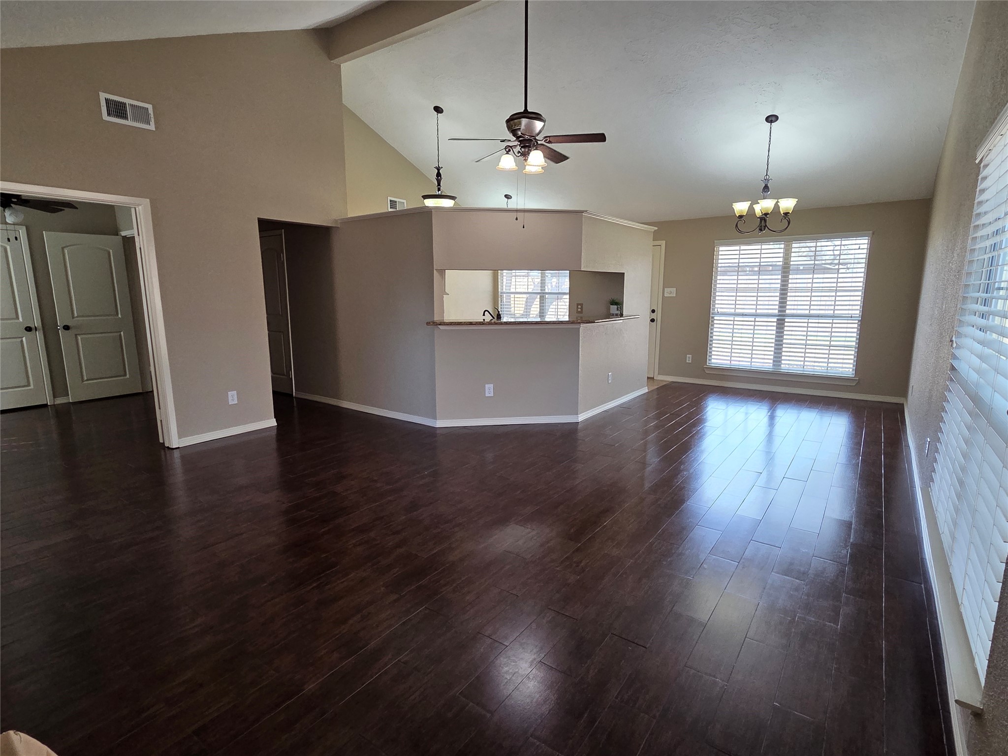 4203 Spinks Creek Lane Spring, TX 77388 - Photo 7 of 14 Large living area and dining area with easy care wood look tile is open to the kitchen. The cathedral ceiling adds to the spacious feeling of this room. Generous windows let in plenty of sunlight.