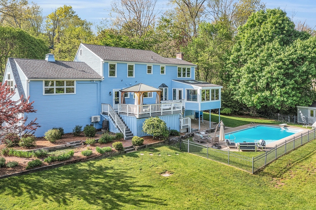 16 Bulette Road Acton, MA 01720 - Photo 1 of 42 a view of a house with swimming pool and sitting area