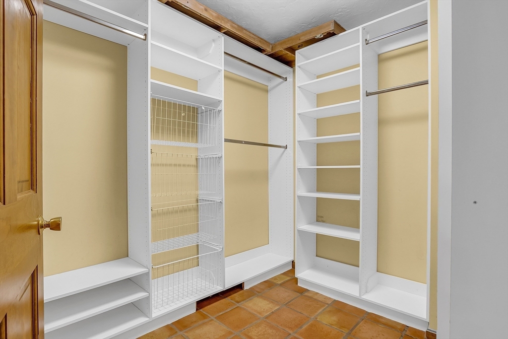 16 Bulette Road Acton, MA 01720 - Photo 11 of 42 a view of walk in closet with empty racks