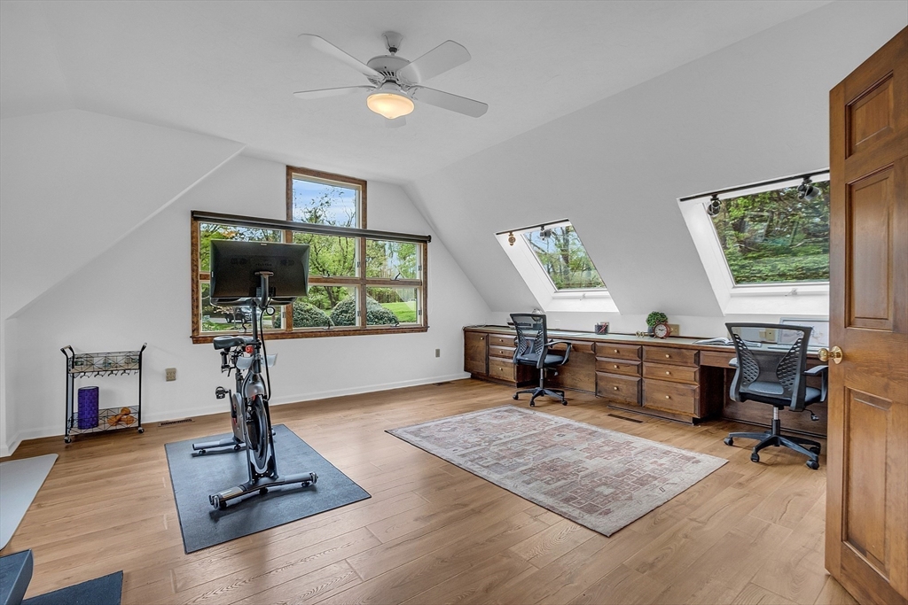 16 Bulette Road Acton, MA 01720 - Photo 14 of 42 a living room with furniture a window and a flat screen tv
