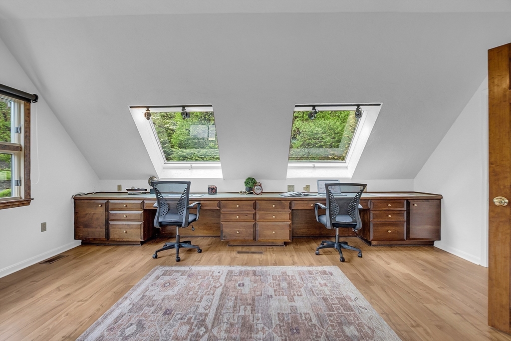 16 Bulette Road Acton, MA 01720 - Photo 15 of 42 a view of a workspace with furniture and a window
