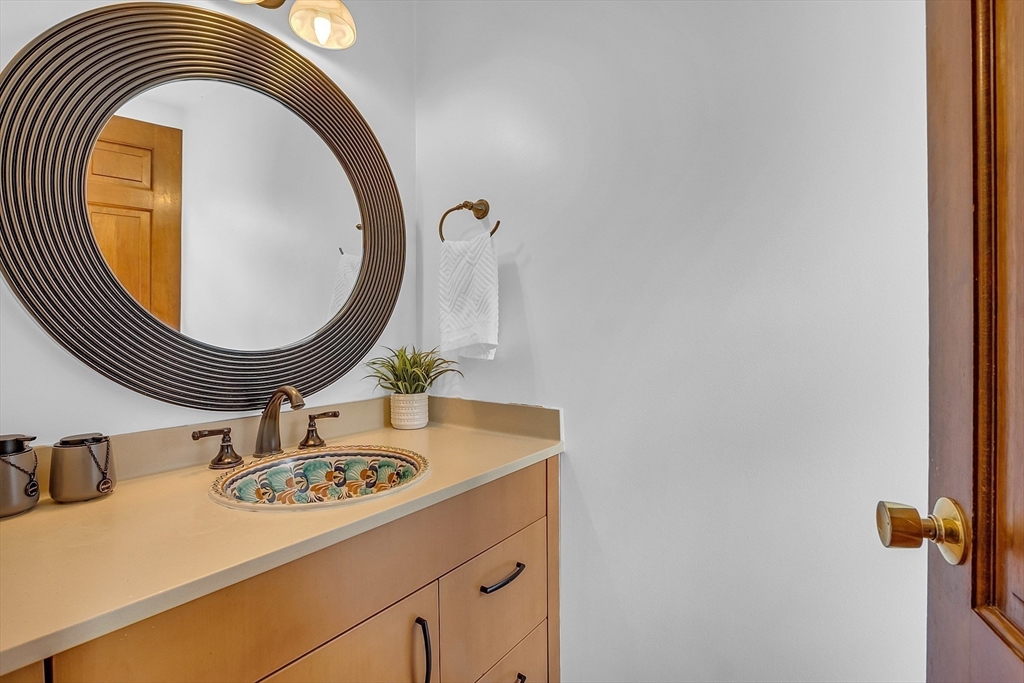16 Bulette Road Acton, MA 01720 - Photo 21 of 42 a bathroom with a sink and a mirror