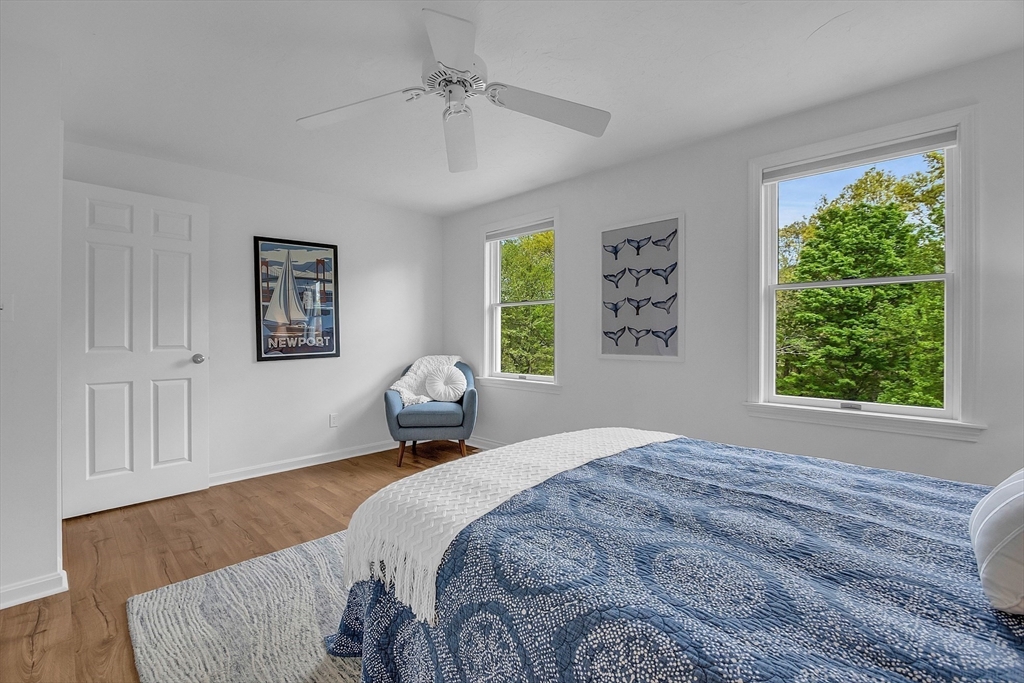 16 Bulette Road Acton, MA 01720 - Photo 26 of 42 a bedroom with a bed and wooden floor