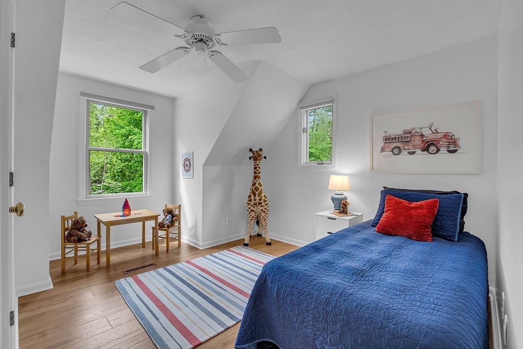 16 Bulette Road Acton, MA 01720 - Photo 29 of 42 a bedroom with a bed and wooden floor