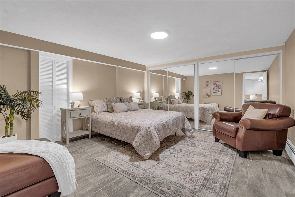 16 Bulette Road Acton, MA 01720 - Photo 30 of 42 a spacious bedroom with a bed and a couch