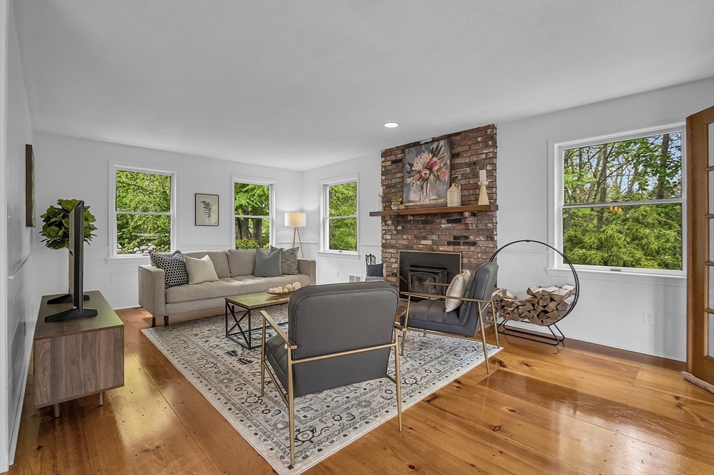 16 Bulette Road Acton, MA 01720 - Photo 3 of 42 a living room with furniture and a fireplace