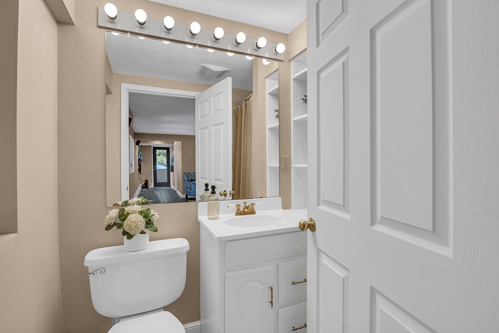 16 Bulette Road Acton, MA 01720 - Photo 34 of 42 a bathroom with a double vanity sink mirror and toilet