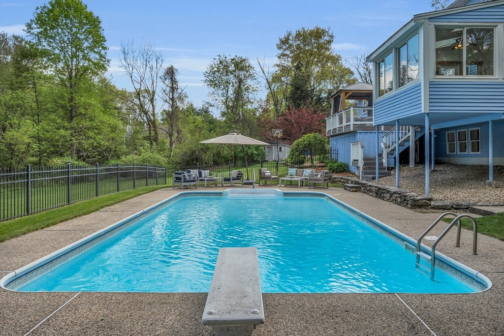 16 Bulette Road Acton, MA 01720 - Photo 36 of 42 a swimming pool with outdoor seating and yard