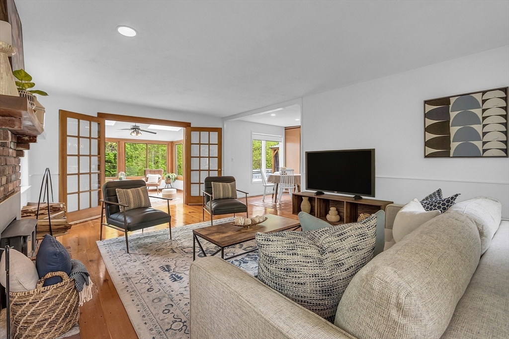 16 Bulette Road Acton, MA 01720 - Photo 4 of 42 a living room with furniture and a flat screen tv