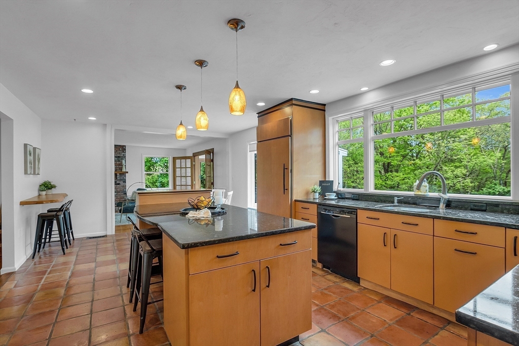 16 Bulette Road Acton, MA 01720 - Photo 10 of 42 a kitchen with granite countertop sink stove and dining table