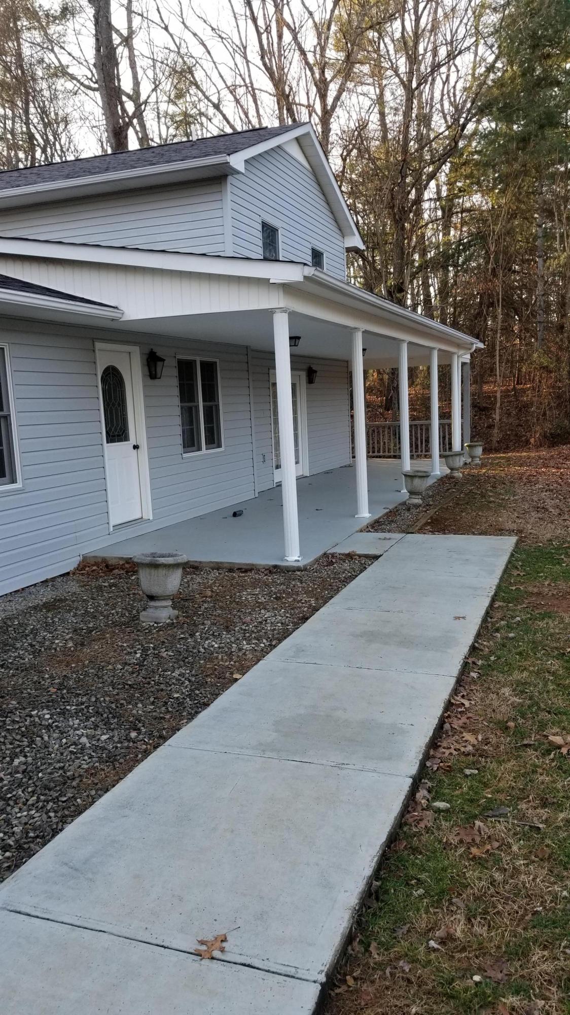 110 Foggy Ridge Road Rocky Mount, VA 24151 - Photo 2 of 35 a front view of a house with garden