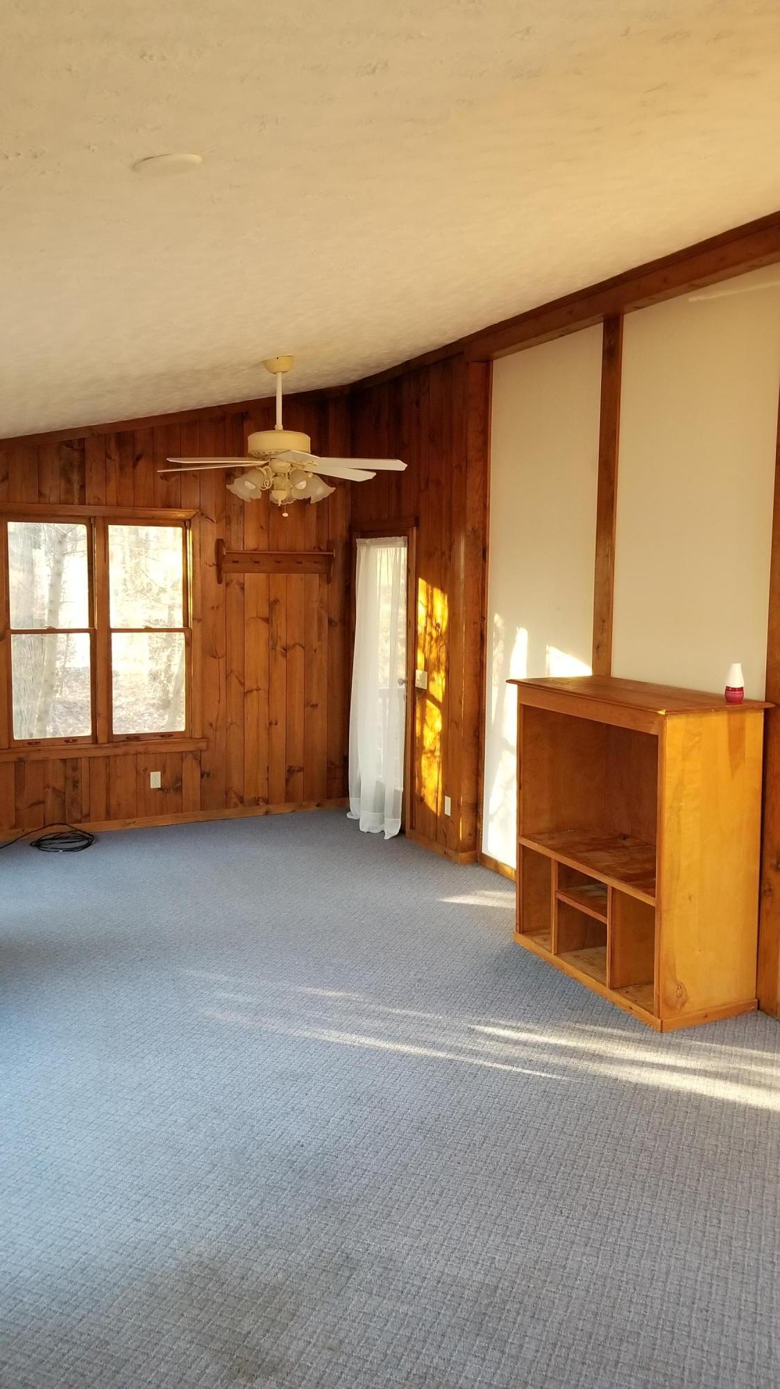 110 Foggy Ridge Road Rocky Mount, VA 24151 - Photo 15 of 35 a view of an empty room with a fireplace and a window