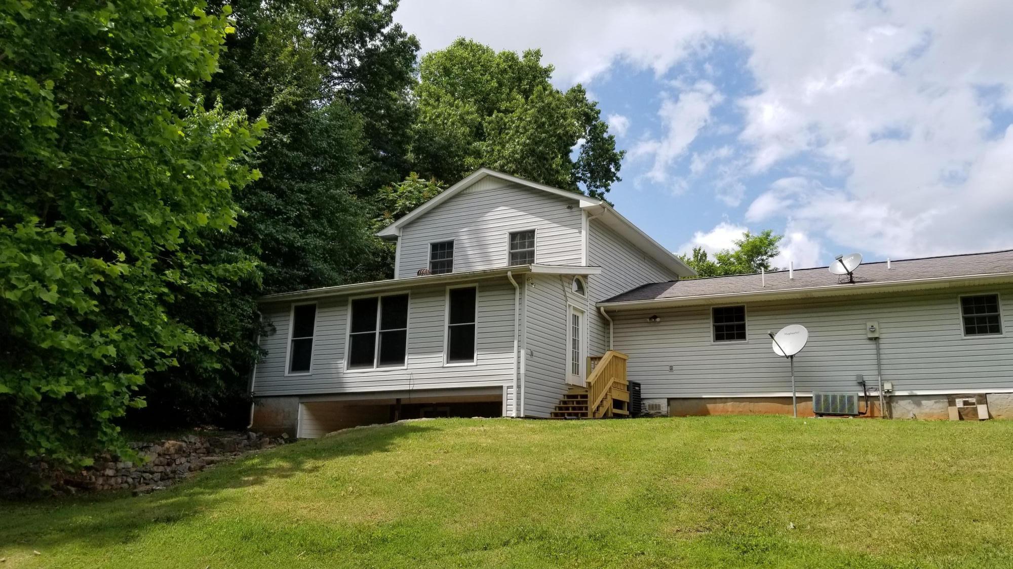 110 Foggy Ridge Road Rocky Mount, VA 24151 - Photo 27 of 35 a front view of a house with a garden