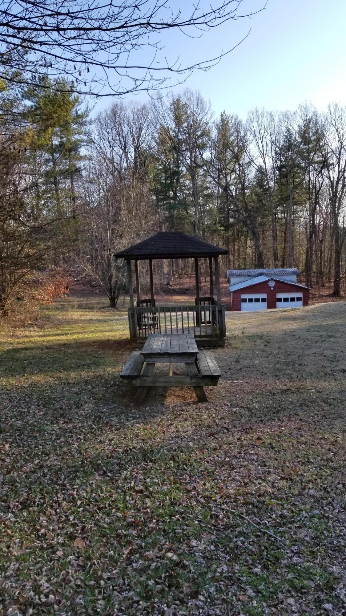 110 Foggy Ridge Road Rocky Mount, VA 24151 - Photo 31 of 35 a view of a bench in a yard