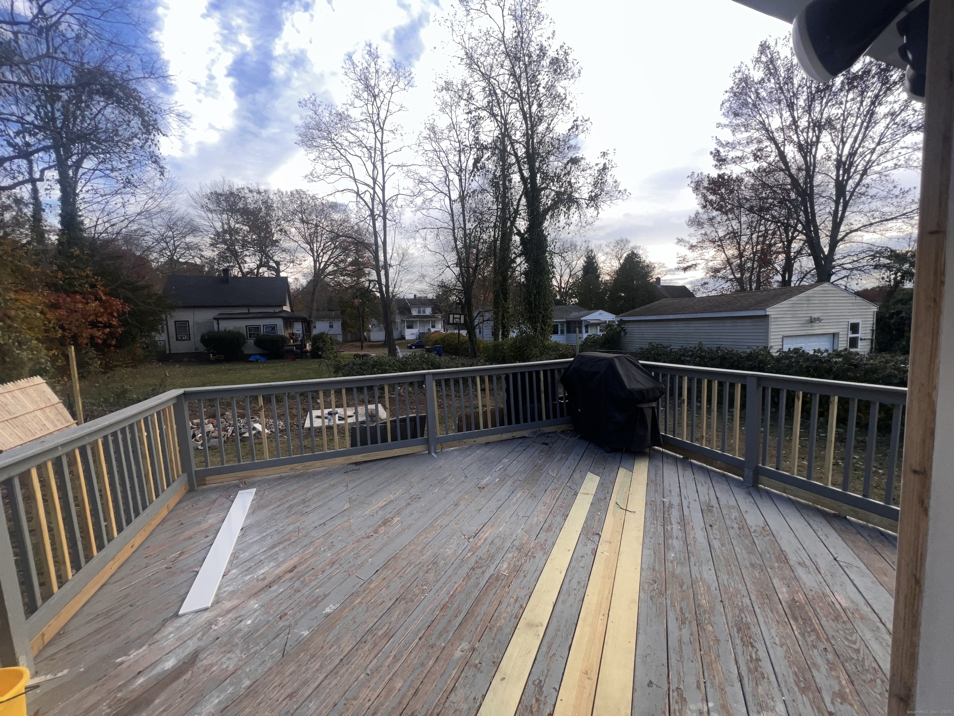 121 Pond Lily Avenue New Haven, CT 06515 - Photo 16 of 22 a view of deck with wooden floor and outdoor seating