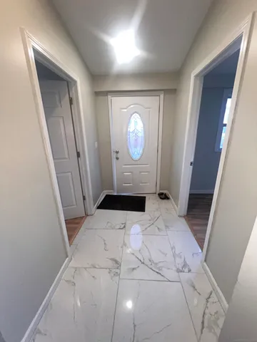 a bedroom with a bed and a mirror