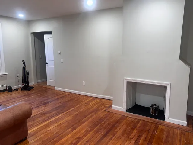 a bedroom with a bed and a mirror