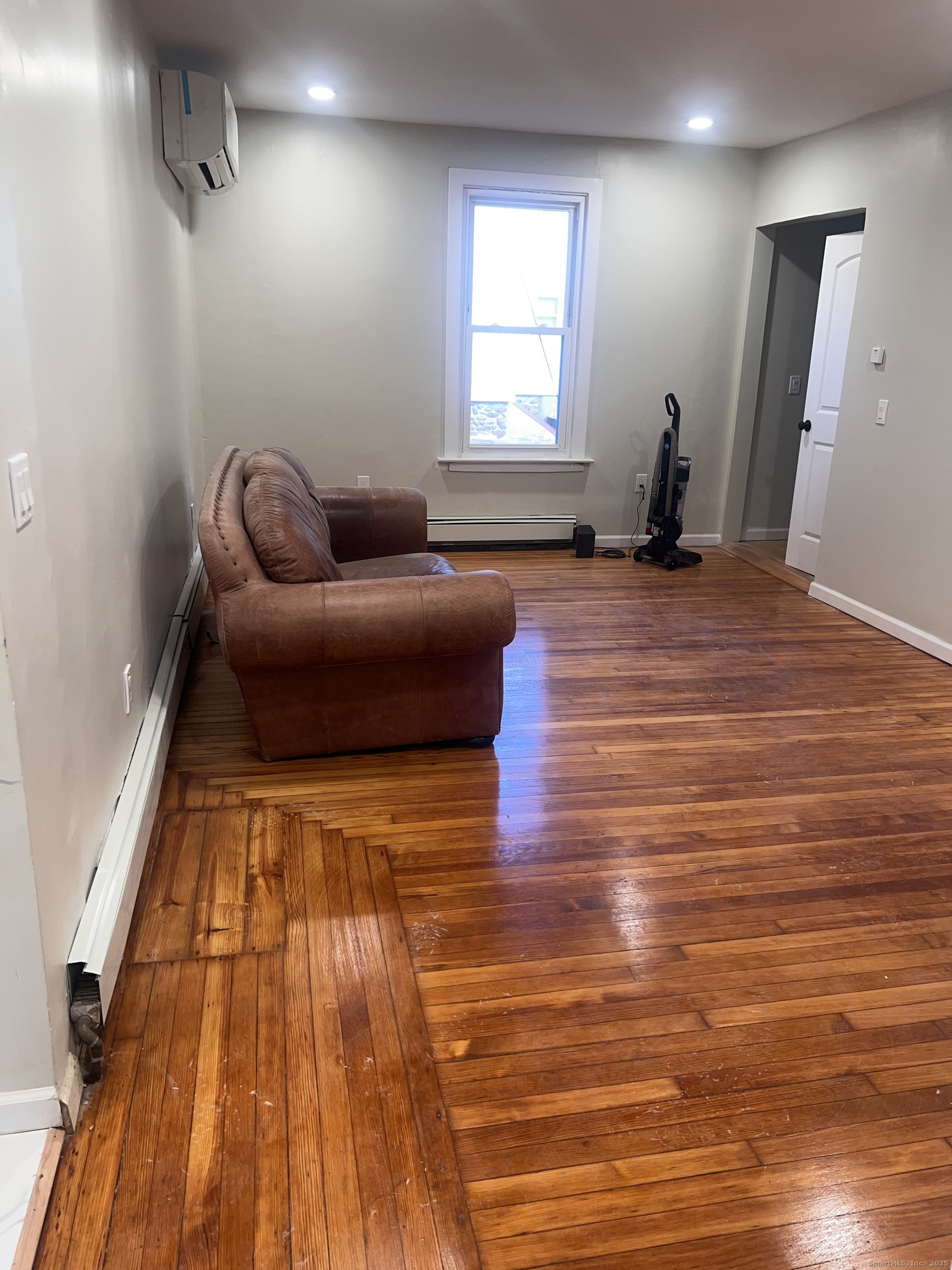121 Pond Lily Avenue New Haven, CT 06515 - Photo 20 of 22 a living room with furniture and a wooden floor