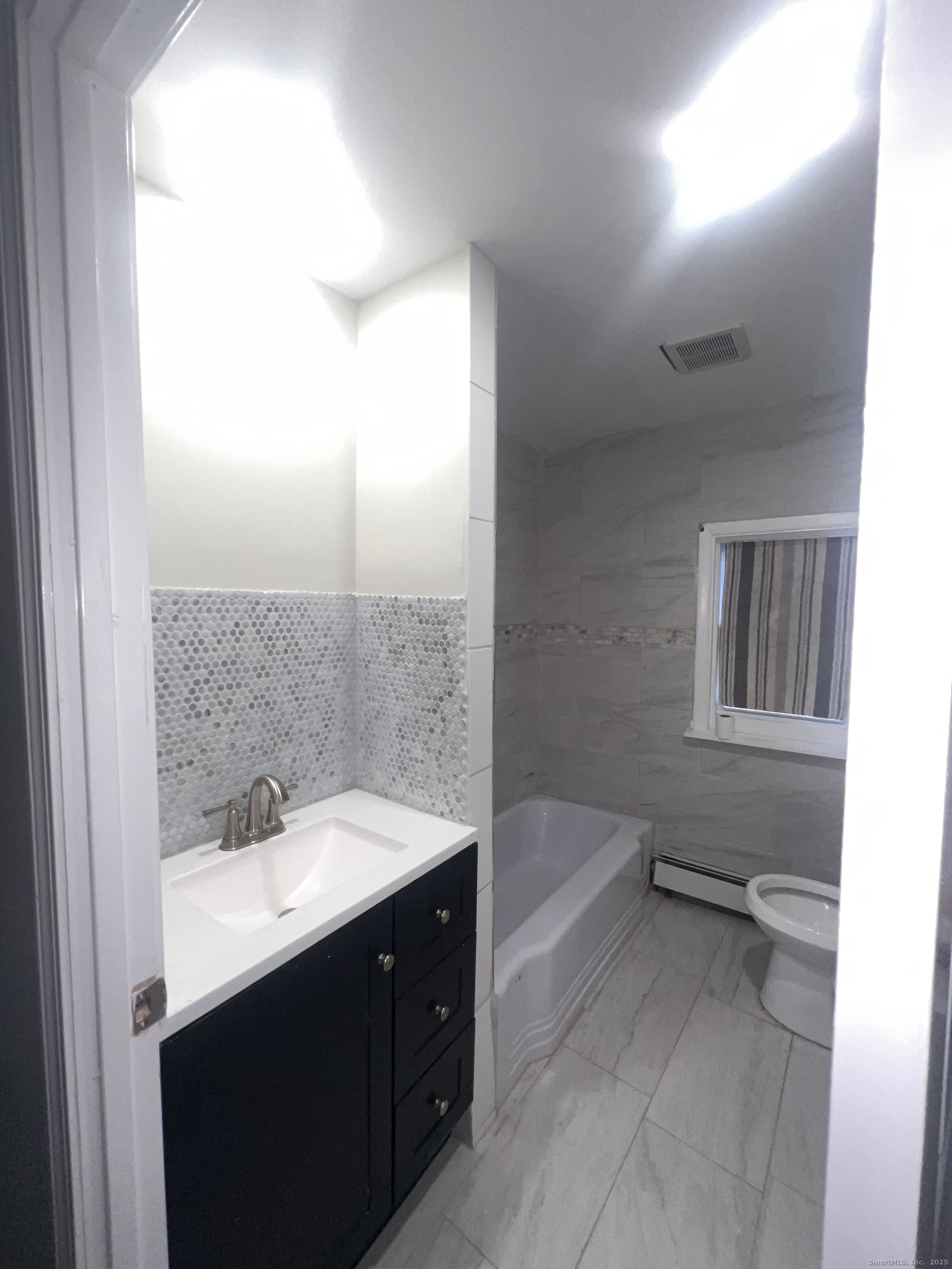 121 Pond Lily Avenue New Haven, CT 06515 - Photo 21 of 22 a bathroom with a sink and a mirror