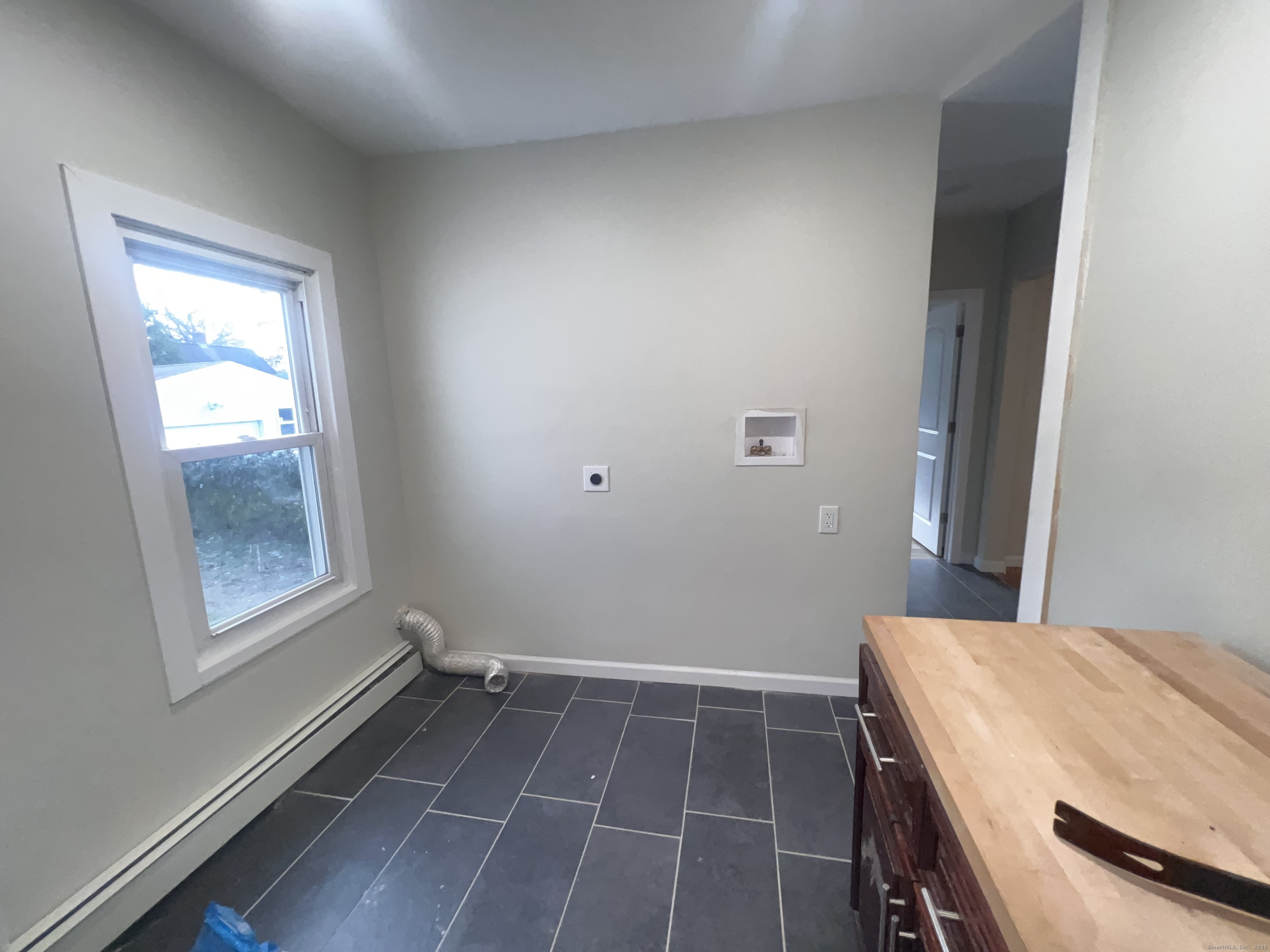 121 Pond Lily Avenue New Haven, CT 06515 - Photo 22 of 22 a room with a table and a window