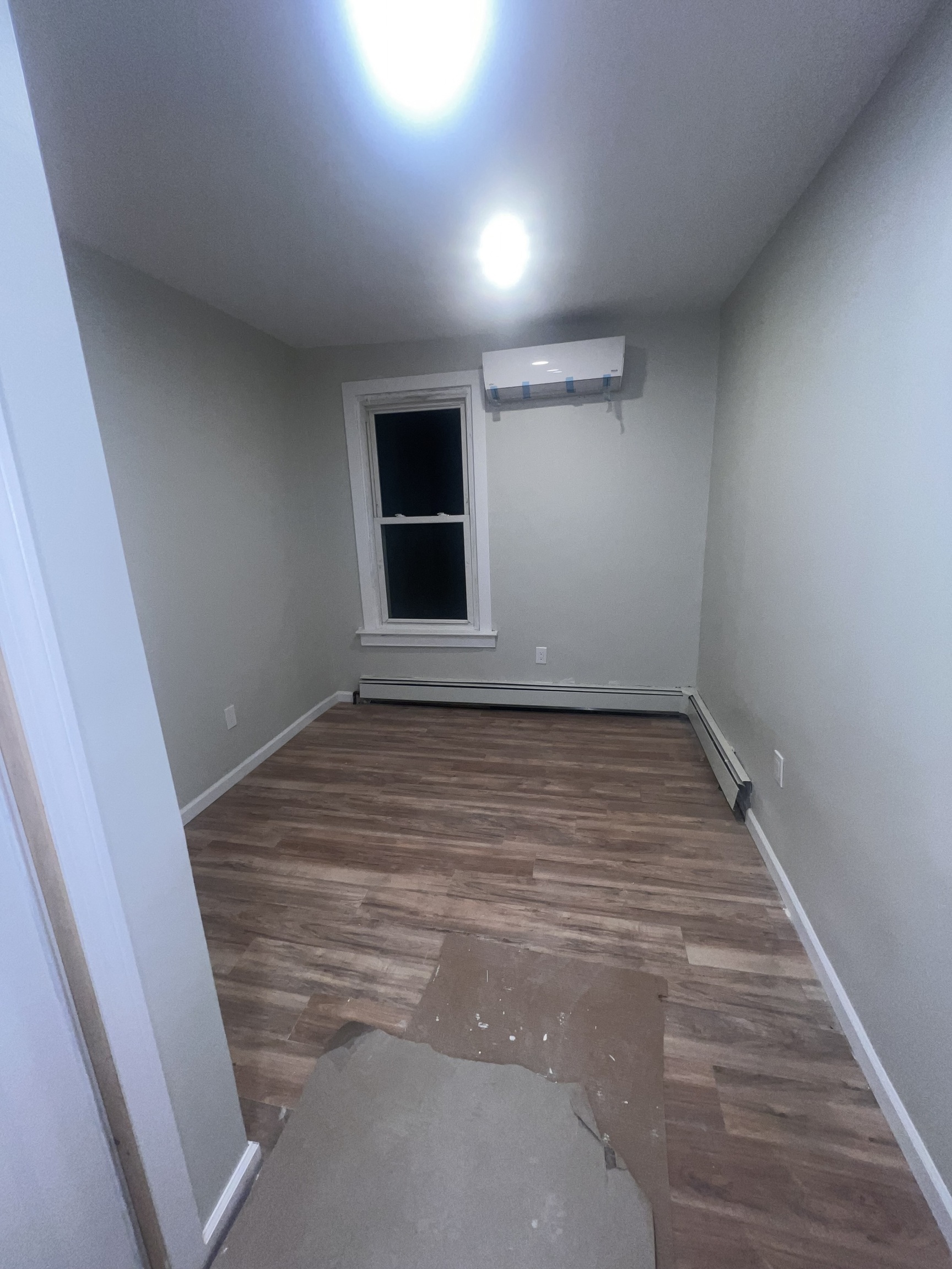 121 Pond Lily Avenue New Haven, CT 06515 - Photo 3 of 22 an empty room with wooden floor and windows
