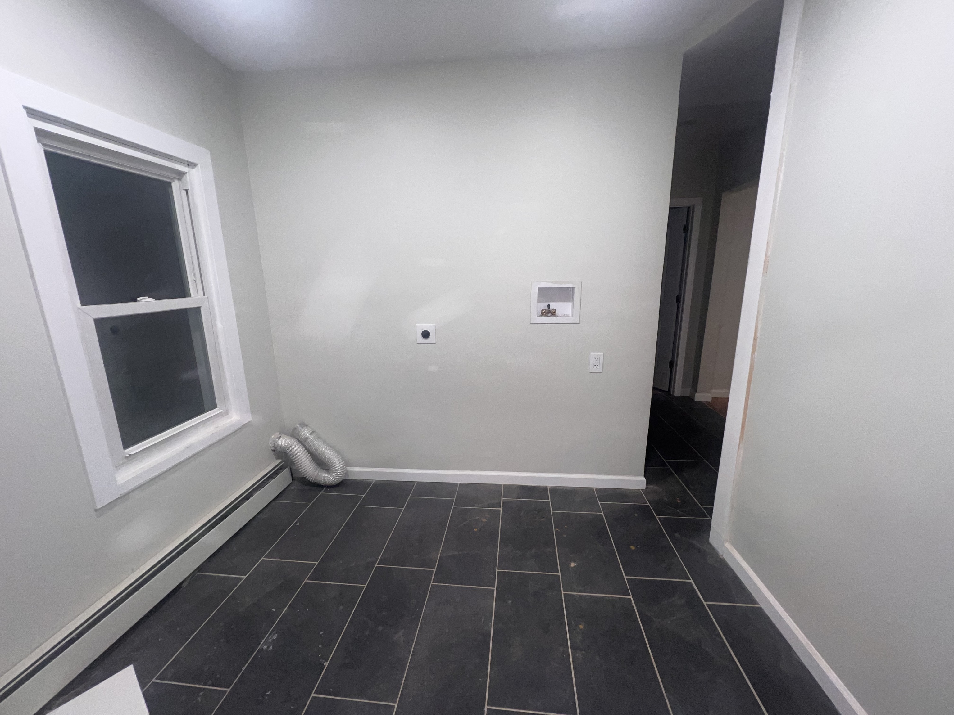 121 Pond Lily Avenue New Haven, CT 06515 - Photo 7 of 22 a view of a room with wooden floor and white walls