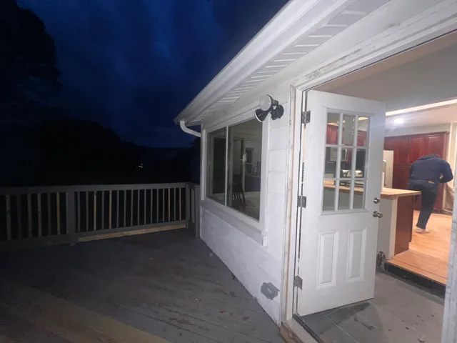 a view of balcony with furniture