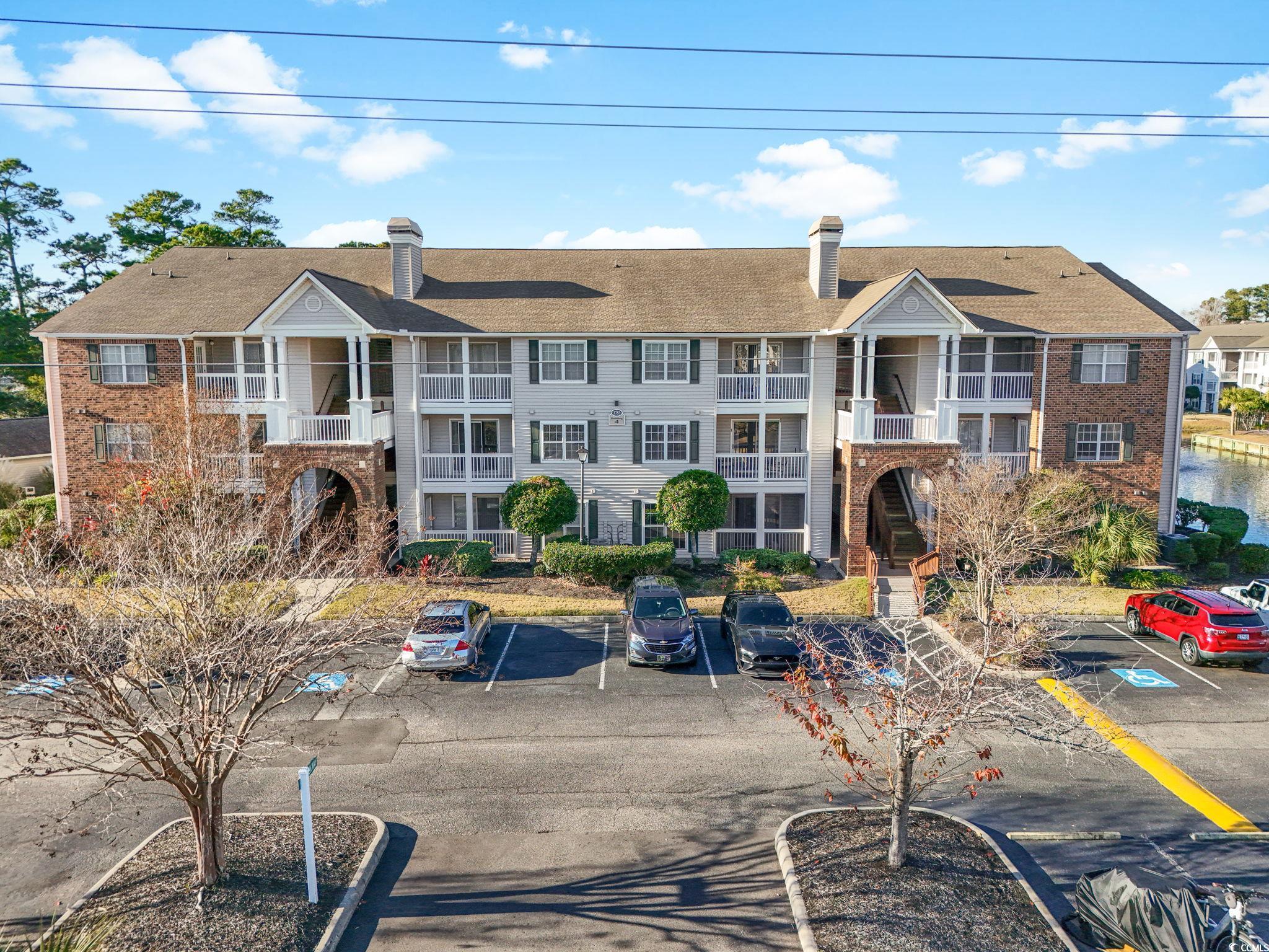 3753 Citation Way, Unit 438 Myrtle Beach, SC 29577 - Photo 1 of 33 View of apartment building / complex with uncovered parking