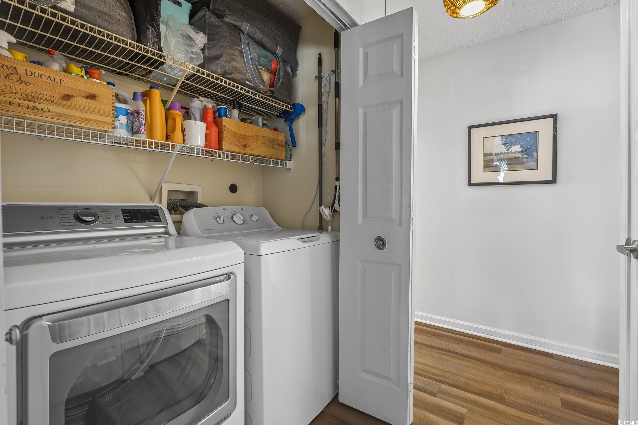 3753 Citation Way, Unit 438 Myrtle Beach, SC 29577 - Photo 16 of 33 Washroom with dark wood-style flooring and separate washer and dryer
