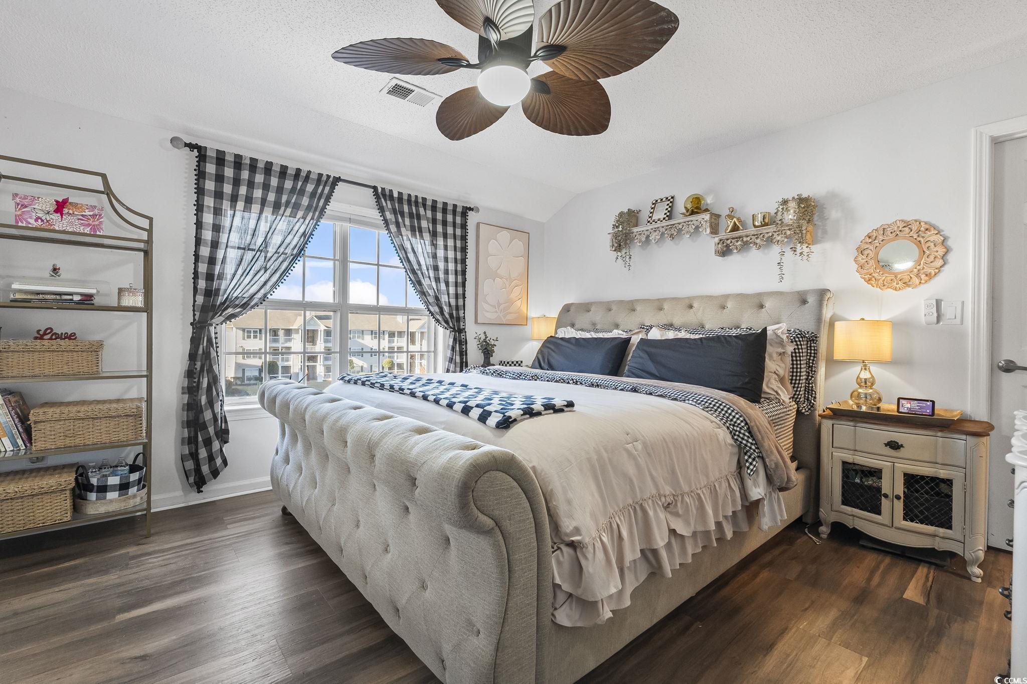 3753 Citation Way, Unit 438 Myrtle Beach, SC 29577 - Photo 17 of 33 Bedroom featuring dark wood-style floors, a textured ceiling, ceiling fan, and vaulted ceiling