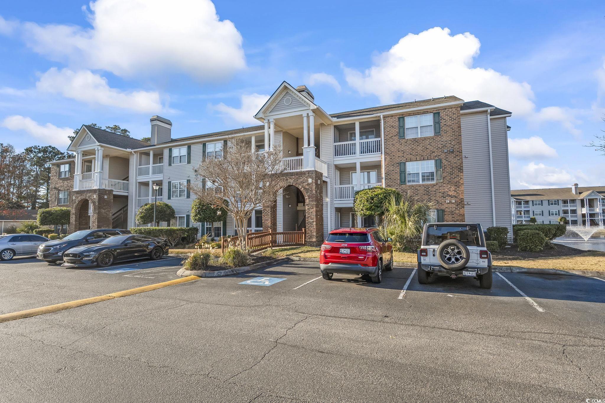3753 Citation Way, Unit 438 Myrtle Beach, SC 29577 - Photo 2 of 33 View of apartment building / complex featuring uncovered parking