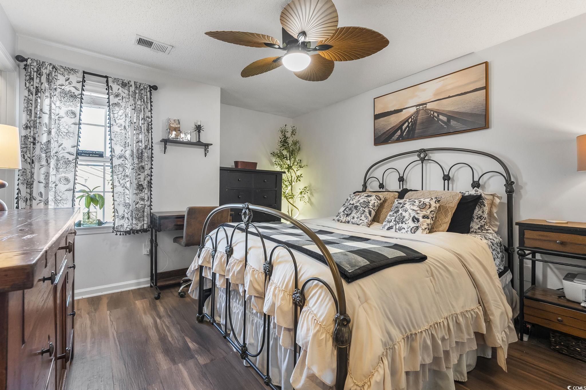 3753 Citation Way, Unit 438 Myrtle Beach, SC 29577 - Photo 21 of 33 Bedroom with dark wood-type flooring and ceiling fan