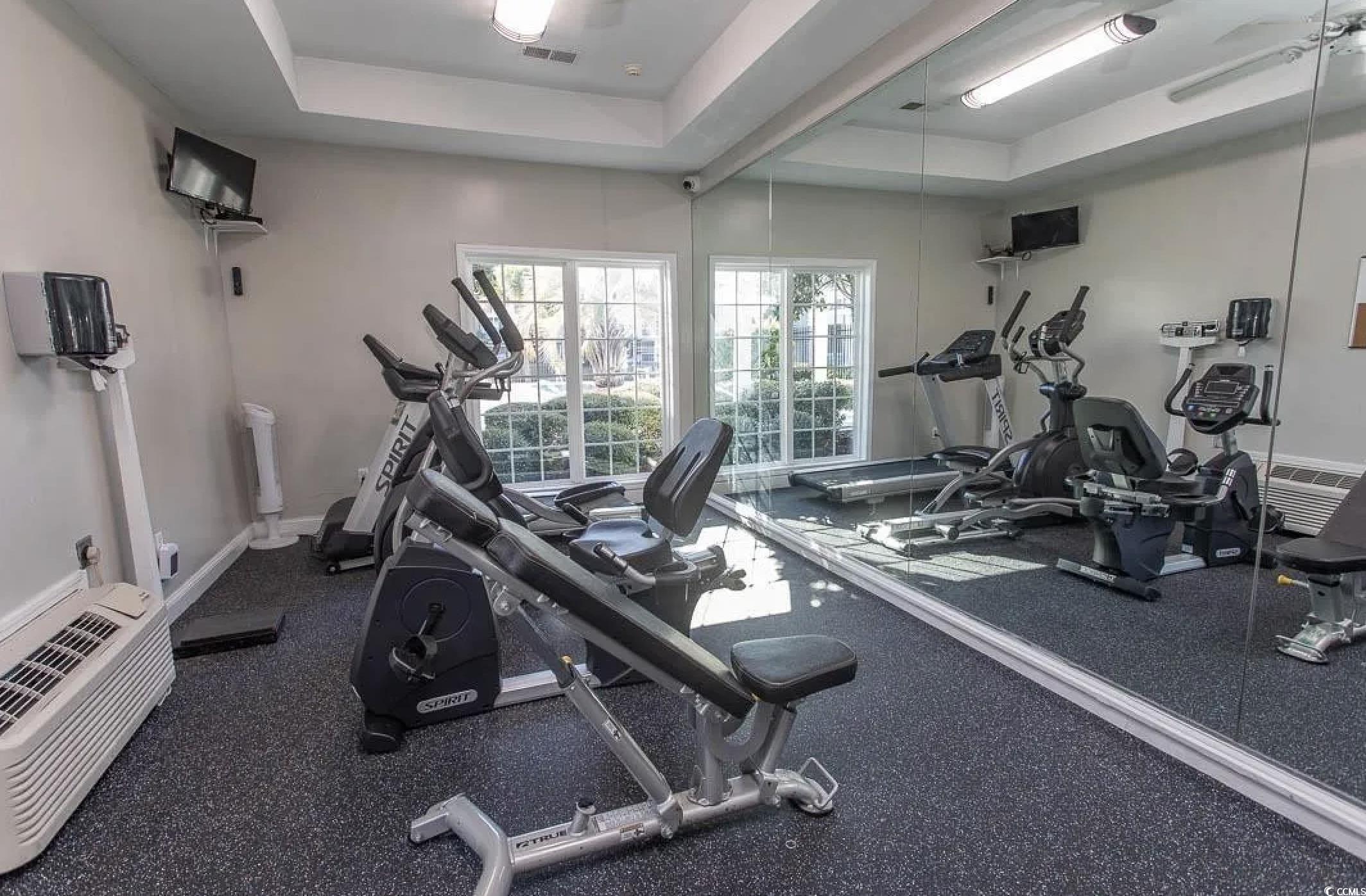 3753 Citation Way, Unit 438 Myrtle Beach, SC 29577 - Photo 29 of 33 Workout area featuring a ceiling fan and a wall unit AC