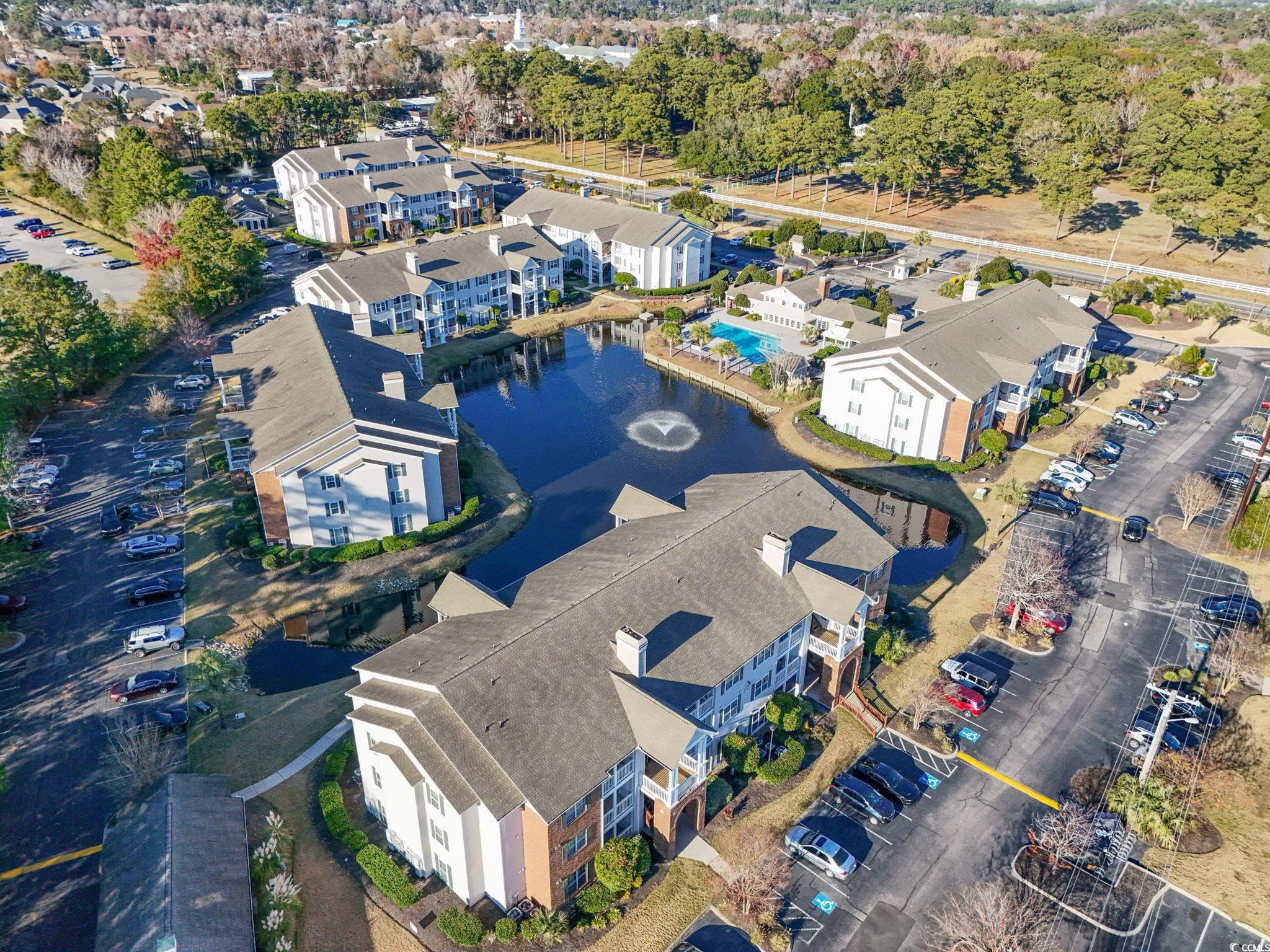 3753 Citation Way, Unit 438 Myrtle Beach, SC 29577 - Photo 3 of 33 View of property location featuring nearby suburban area and a tree filled landscape