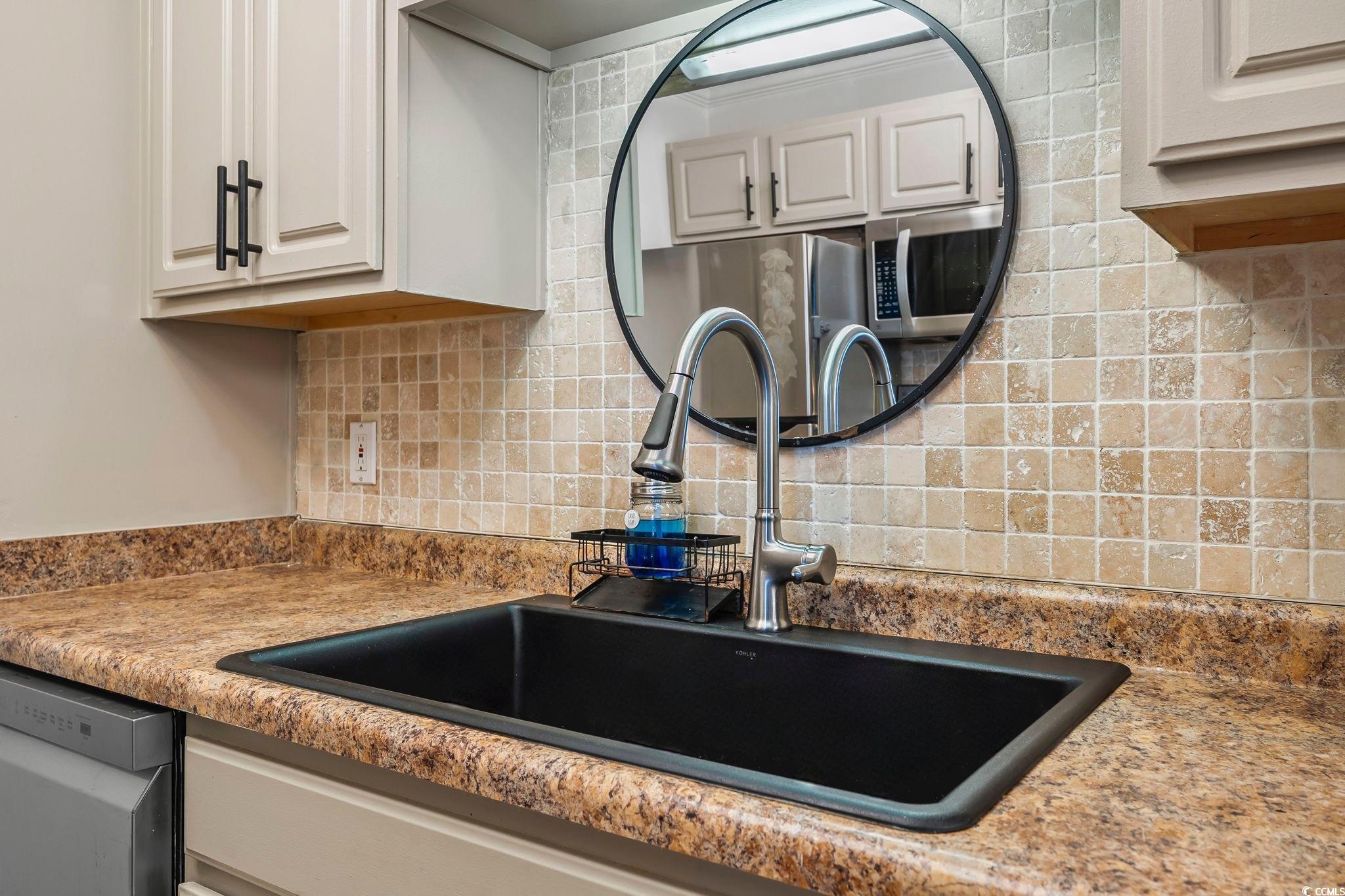 3753 Citation Way, Unit 438 Myrtle Beach, SC 29577 - Photo 7 of 33 Kitchen view of stainless steel appliances and tasteful backsplash